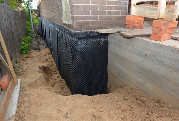 Happy homeowners after waterproofing job in Mattoon